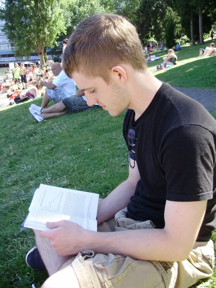 Thomas reading Ron Paul's End the Fed at Madison Park